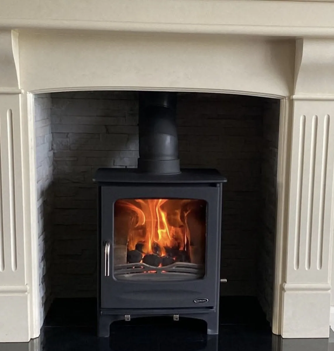 Cream mantel alcove with cast iron stove